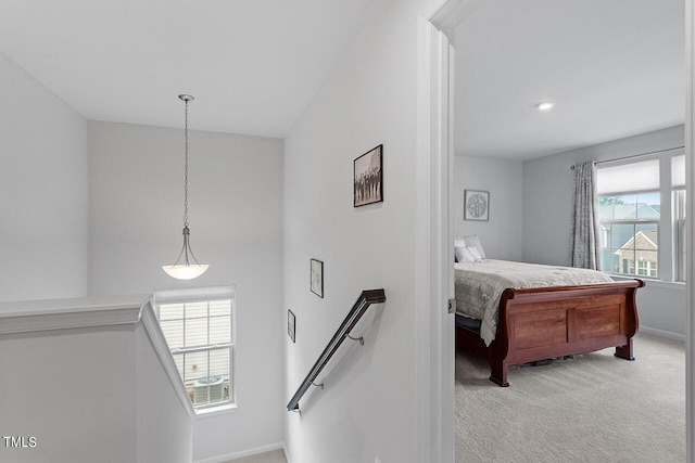 bedroom featuring light colored carpet