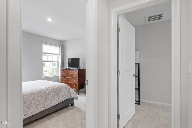 bedroom with light carpet