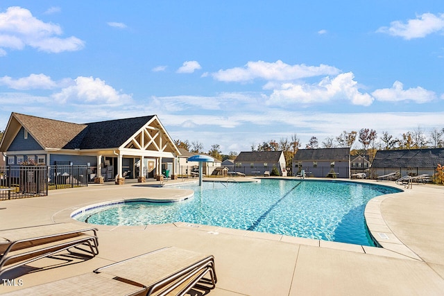 view of swimming pool with a patio