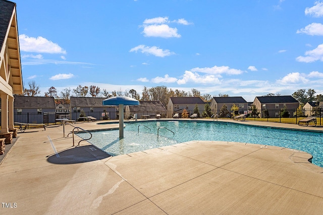 view of swimming pool with a patio