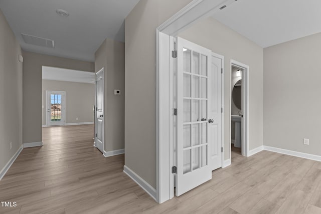 hallway featuring light wood-type flooring