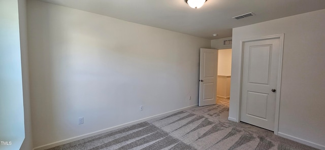 unfurnished bedroom with light carpet