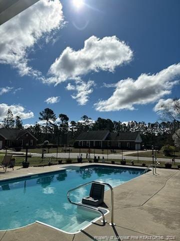 view of pool featuring a patio