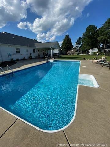 view of pool with a patio area