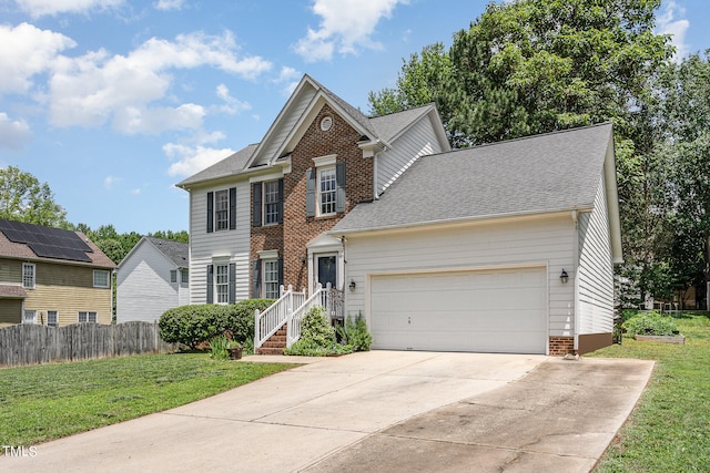 view of front of property with solar panels and a front lawn