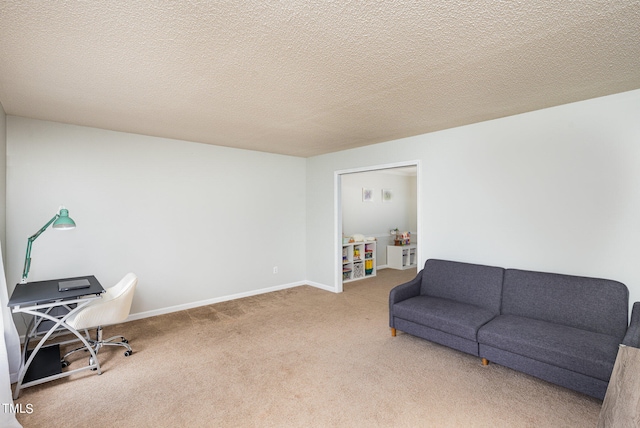 living area featuring a textured ceiling and carpet floors