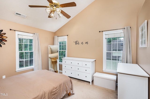 carpeted bedroom with lofted ceiling and ceiling fan