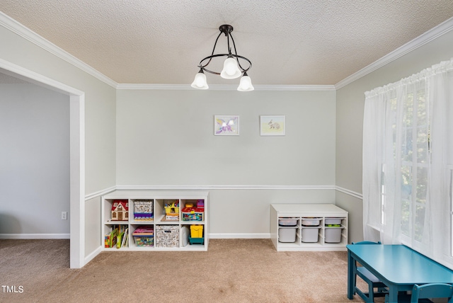 rec room featuring a notable chandelier, carpet, a textured ceiling, and crown molding