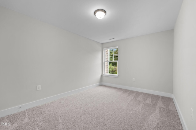 unfurnished room featuring carpet