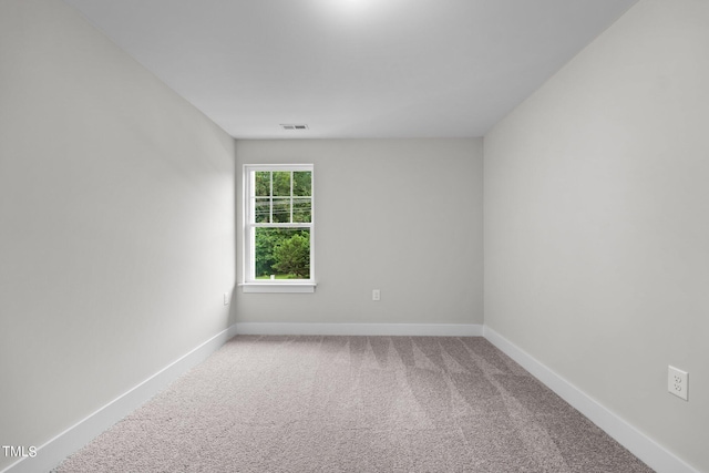 spare room with carpet floors