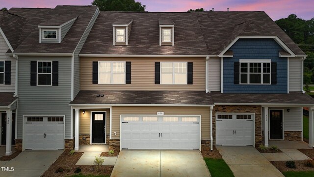 townhome / multi-family property with a garage