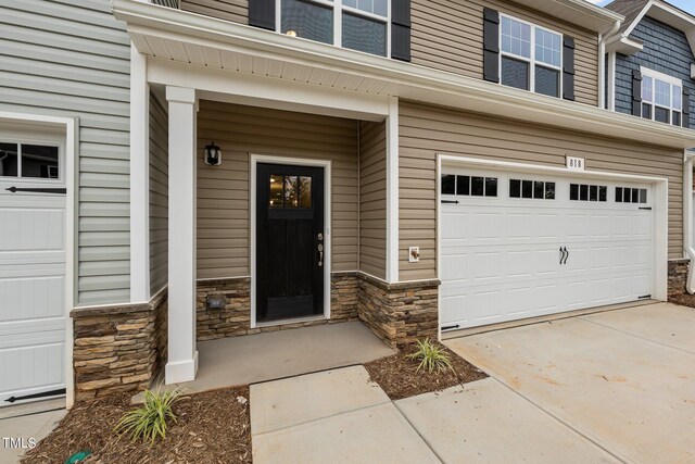 property entrance with a garage