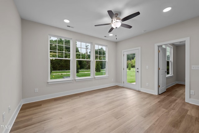 spare room with ceiling fan and light hardwood / wood-style flooring