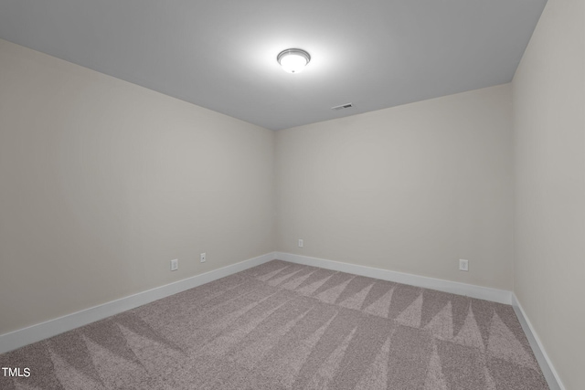 unfurnished room featuring carpet flooring