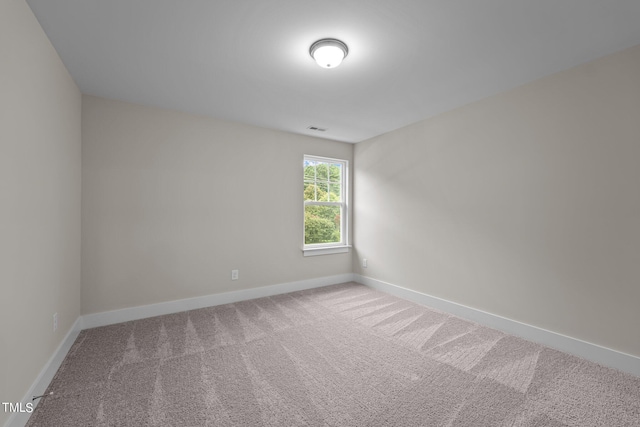 unfurnished room featuring carpet