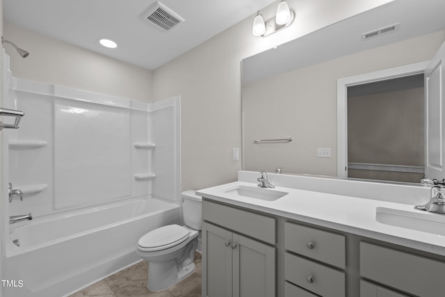 full bathroom with shower / washtub combination, vanity, tile patterned floors, and toilet