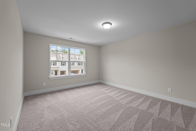 empty room featuring carpet flooring