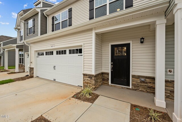 view of exterior entry featuring a garage