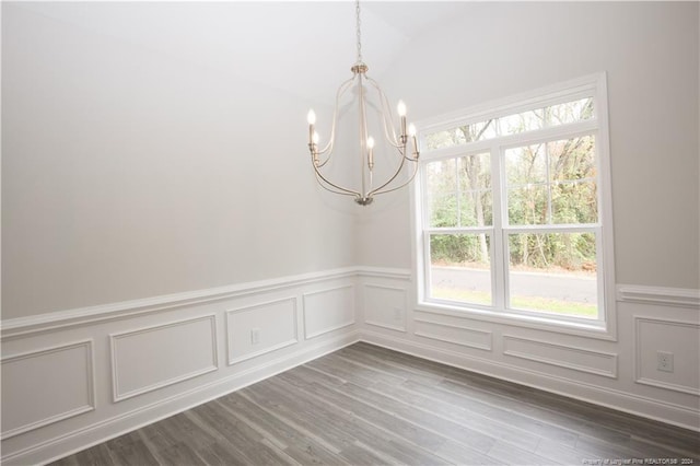 816 Red Hawk Pl, Vass, NC 28394 - unfurnished room featuring a chandelier, a decorative wall, wainscoting, vaulted ceiling, and dark wood finished floors