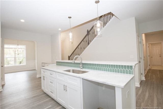 816 Red Hawk Pl, Vass, NC 28394 - kitchen featuring light wood-style floors, a chandelier, white cabinets, hanging light fixtures, and recessed lighting