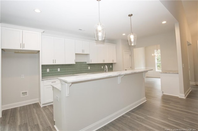 816 Red Hawk Pl, Vass, NC 28394 - kitchen with white cabinets, decorative backsplash, wood finished floors, and recessed lighting