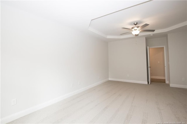 816 Red Hawk Pl, Vass, NC 28394 - spare room with a tray ceiling, ceiling fan, and light colored carpet