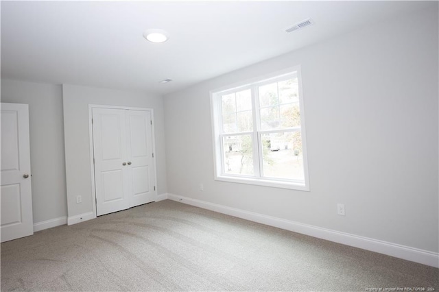 816 Red Hawk Pl, Vass, NC 28394 - unfurnished bedroom featuring carpet flooring and a closet