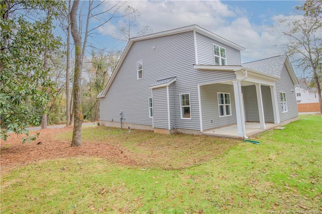 816 Red Hawk Pl, Vass, NC 28394 - view of side of home with a patio, a lawn, and roof with shingles