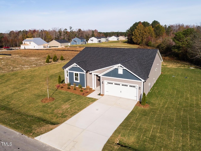 view of front facade with a front yard and a garage