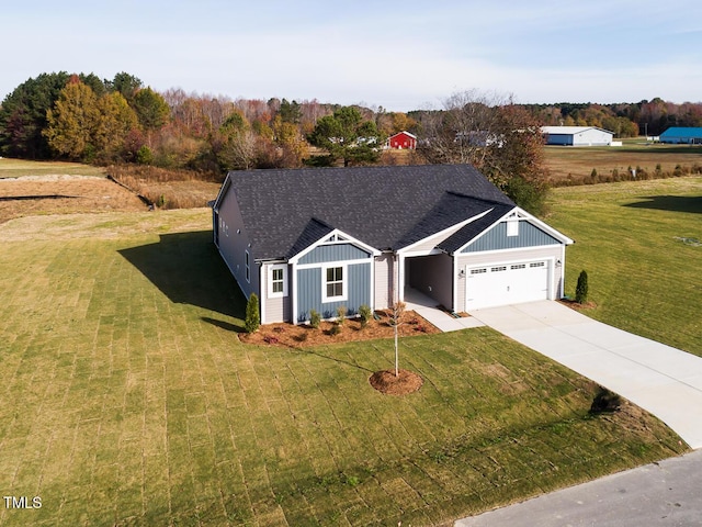 view of front facade with a front lawn and a garage