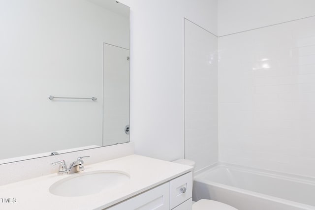 full bathroom with washtub / shower combination, vanity, and toilet