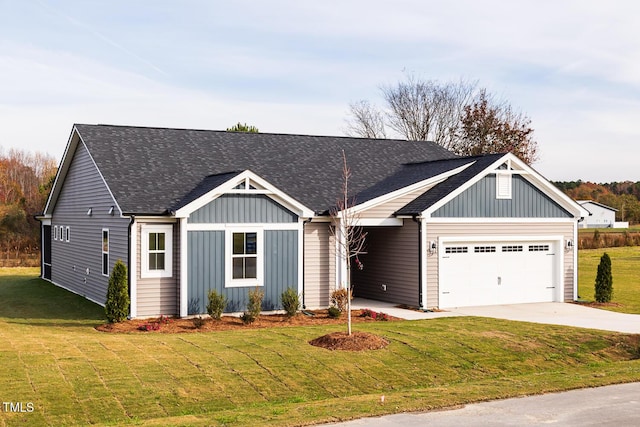 view of front facade with a garage and a front yard