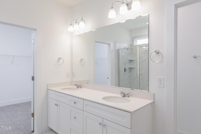 bathroom with vanity and walk in shower