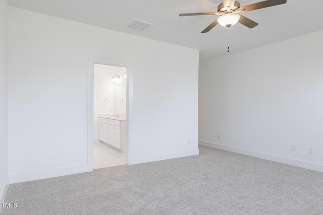 unfurnished bedroom with connected bathroom, ceiling fan, and light colored carpet