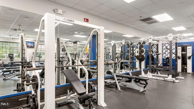 exercise room featuring a paneled ceiling