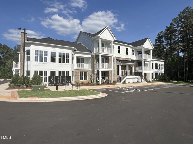 view of front of home with a balcony