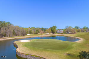 surrounding community with a water view