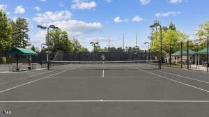 view of sport court featuring basketball hoop