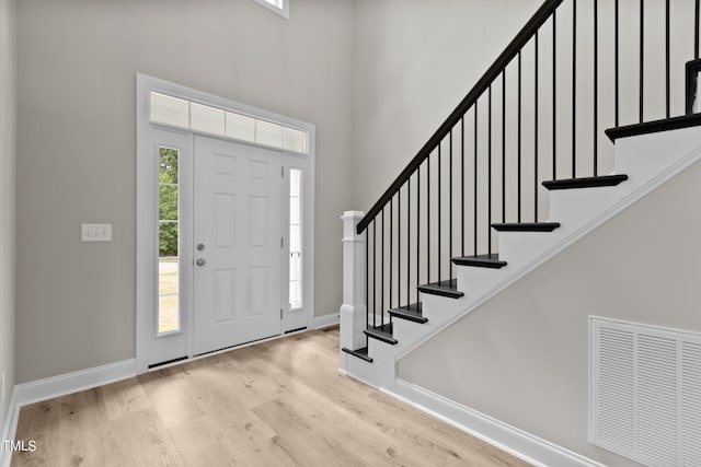 entrance foyer with light hardwood / wood-style floors