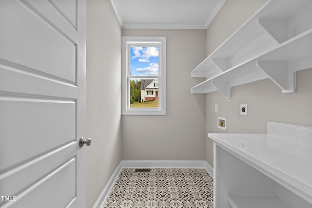 laundry room featuring tile patterned floors, crown molding, hookup for a washing machine, and hookup for an electric dryer