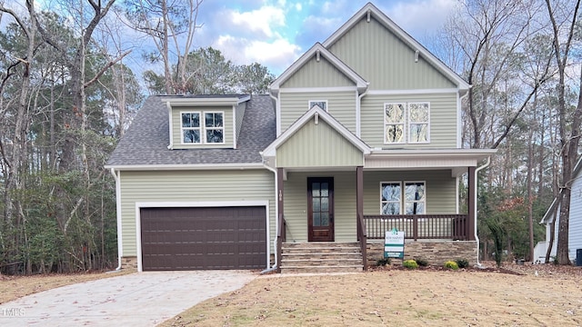 craftsman-style house with a garage and covered porch