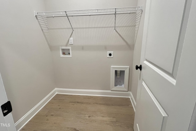 laundry room featuring hardwood / wood-style flooring, hookup for an electric dryer, and hookup for a washing machine