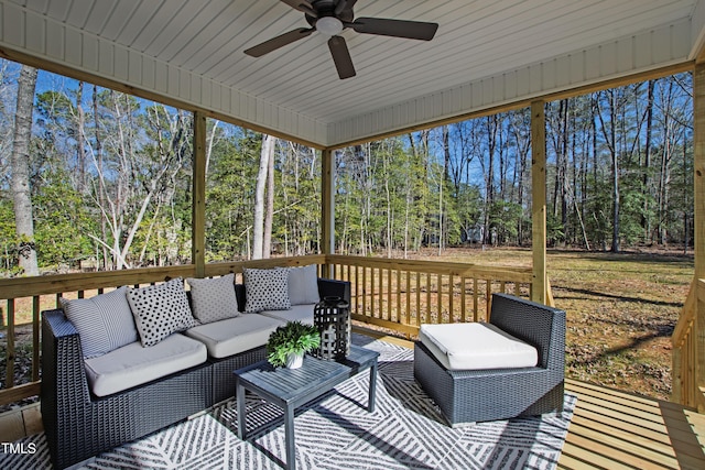 sunroom / solarium with a ceiling fan