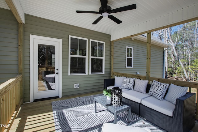 sunroom featuring ceiling fan