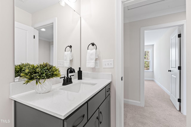 bathroom with baseboards and vanity