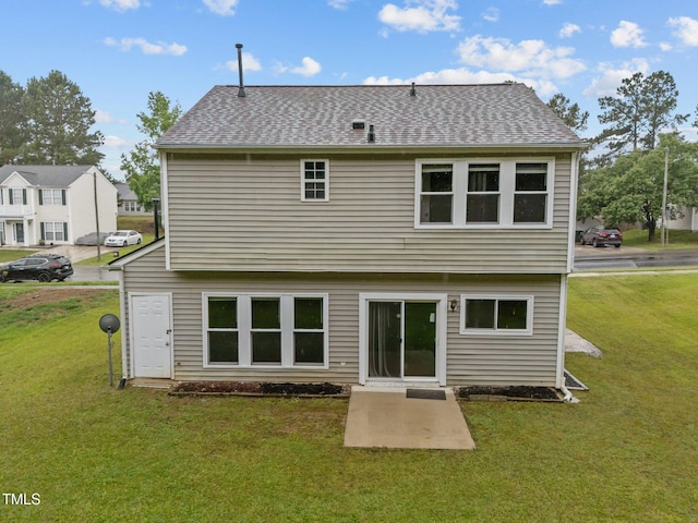 612 Quartz Dr, Durham, NC 27703 - rear view of property with a yard, a patio area, and roof with shingles
