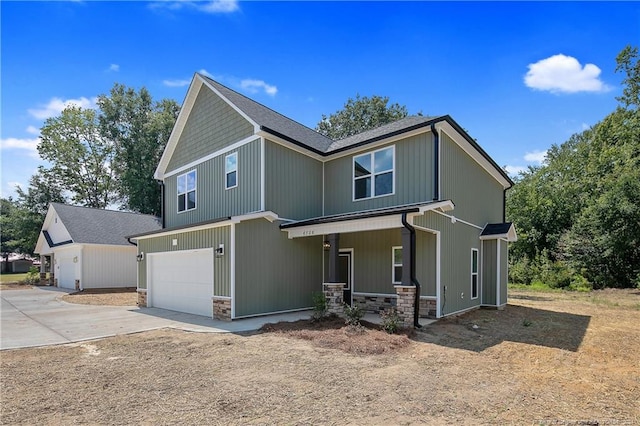 view of front of property featuring a porch and a garage