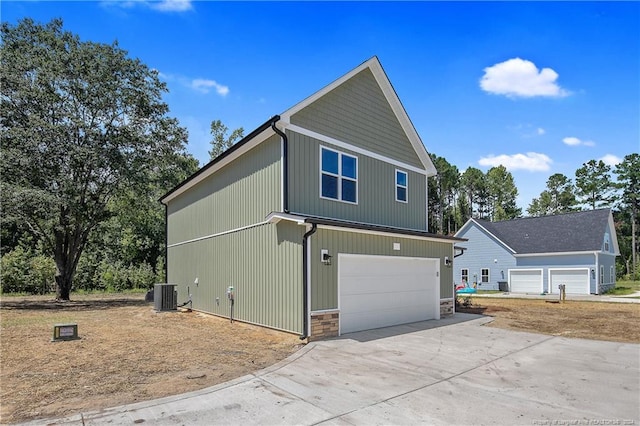 exterior space featuring central AC and a garage