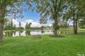 592 Barbour Farm Ln, Four Oaks, NC 27524 - view of green lawn featuring a water view