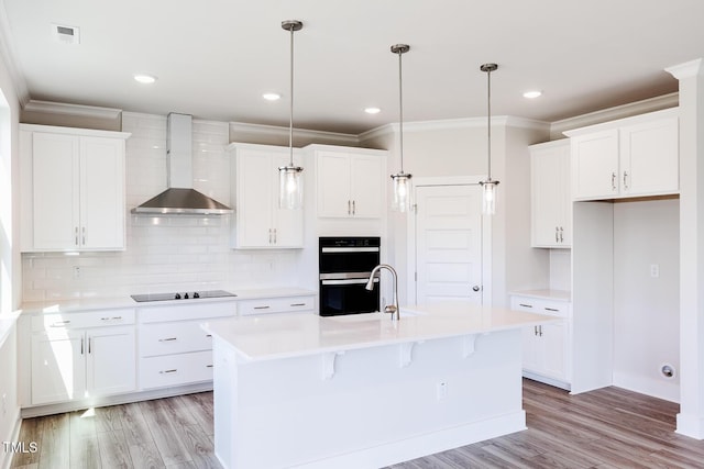 592 Barbour Farm Ln, Four Oaks, NC 27524 - kitchen featuring wall chimney exhaust hood, black appliances, crown molding, light wood-type flooring, and backsplash